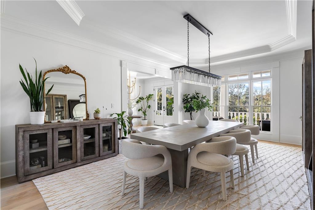 7160 Bennett Road Cumming, GA 30041 - Photo 7 of 83 a view of a dining room with furniture window and wooden floor