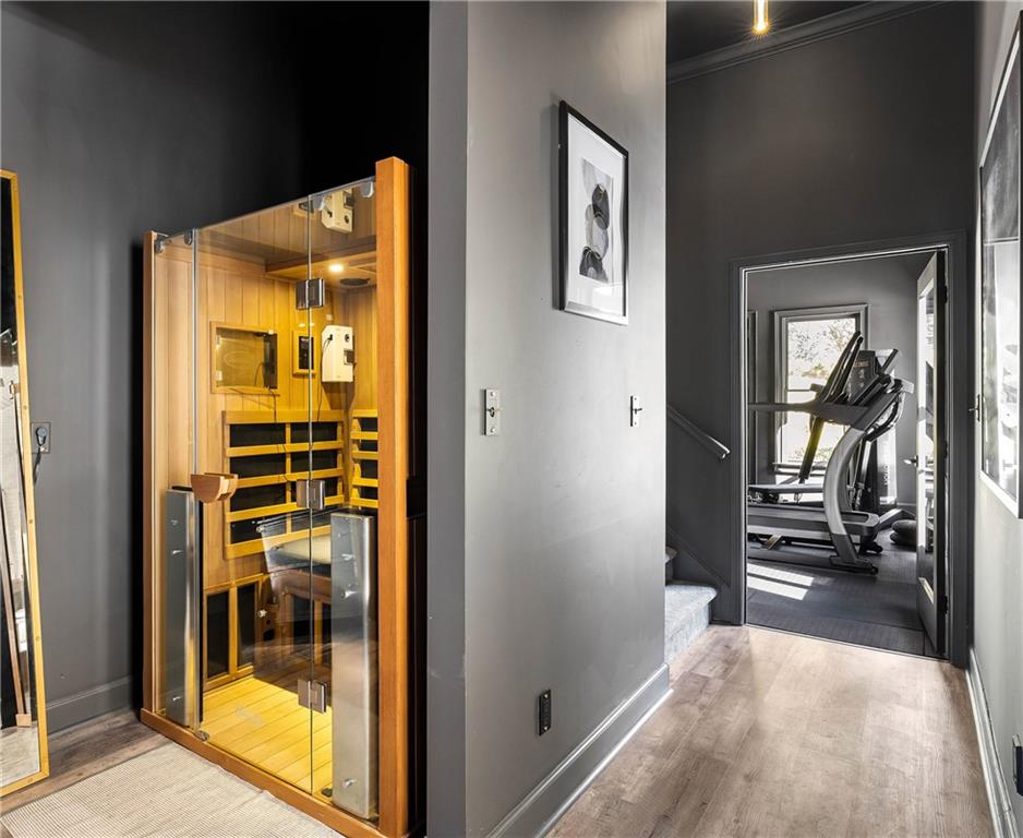 7160 Bennett Road Cumming, GA 30041 - Photo 72 of 83 a view of a hallway with wooden floor and a living room
