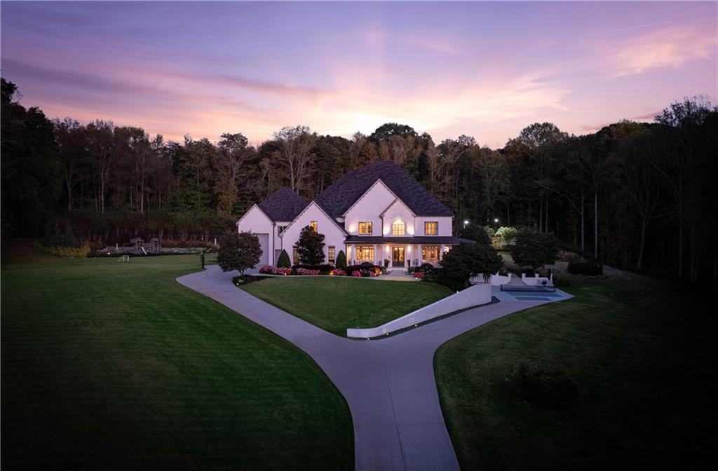 7160 Bennett Road Cumming, GA 30041 - Photo 81 of 83 a front view of a house with garden