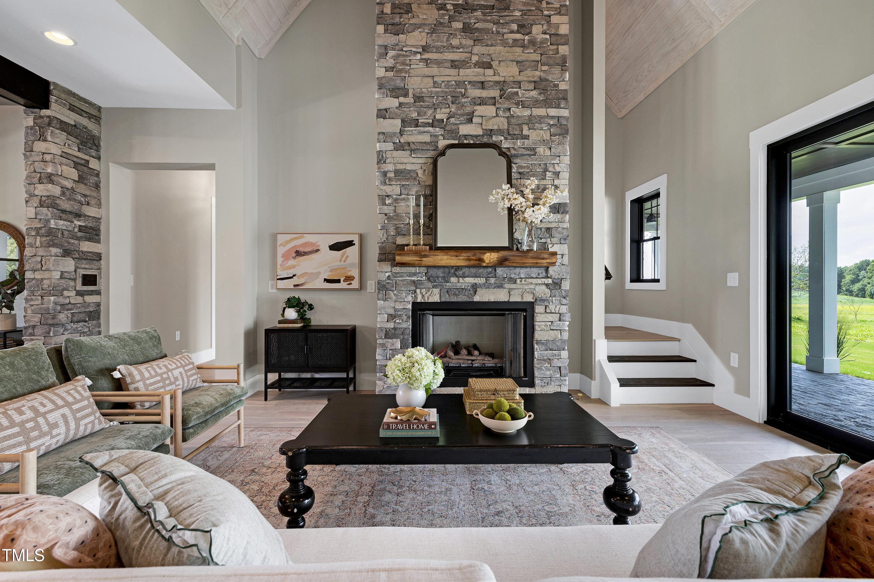6509 Zebulon Road Wake Forest, NC 27587 - Photo 23 of 100 a living room with furniture and a fireplace