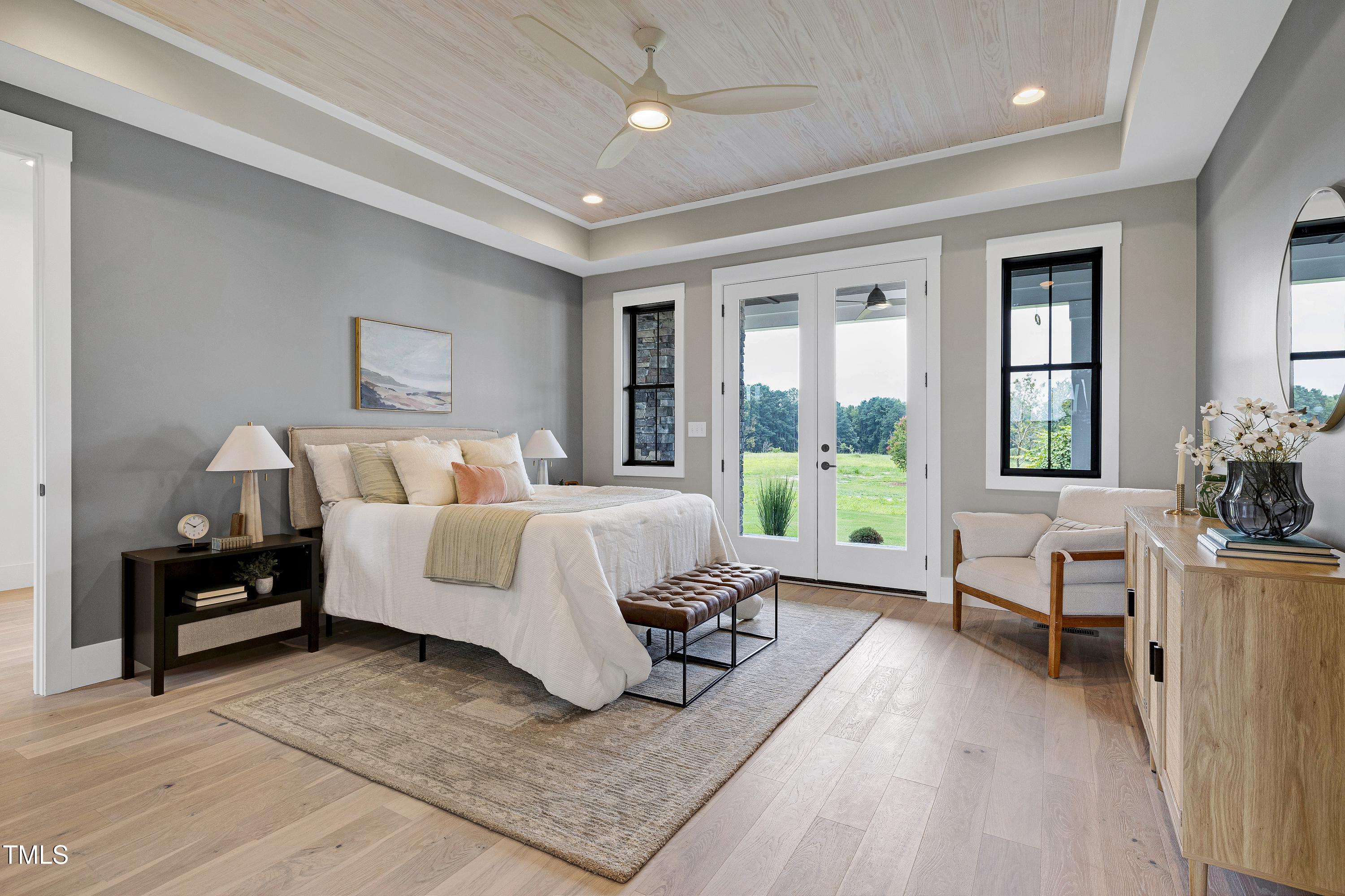 6509 Zebulon Road Wake Forest, NC 27587 - Photo 27 of 100 a bedroom with furniture and a large window