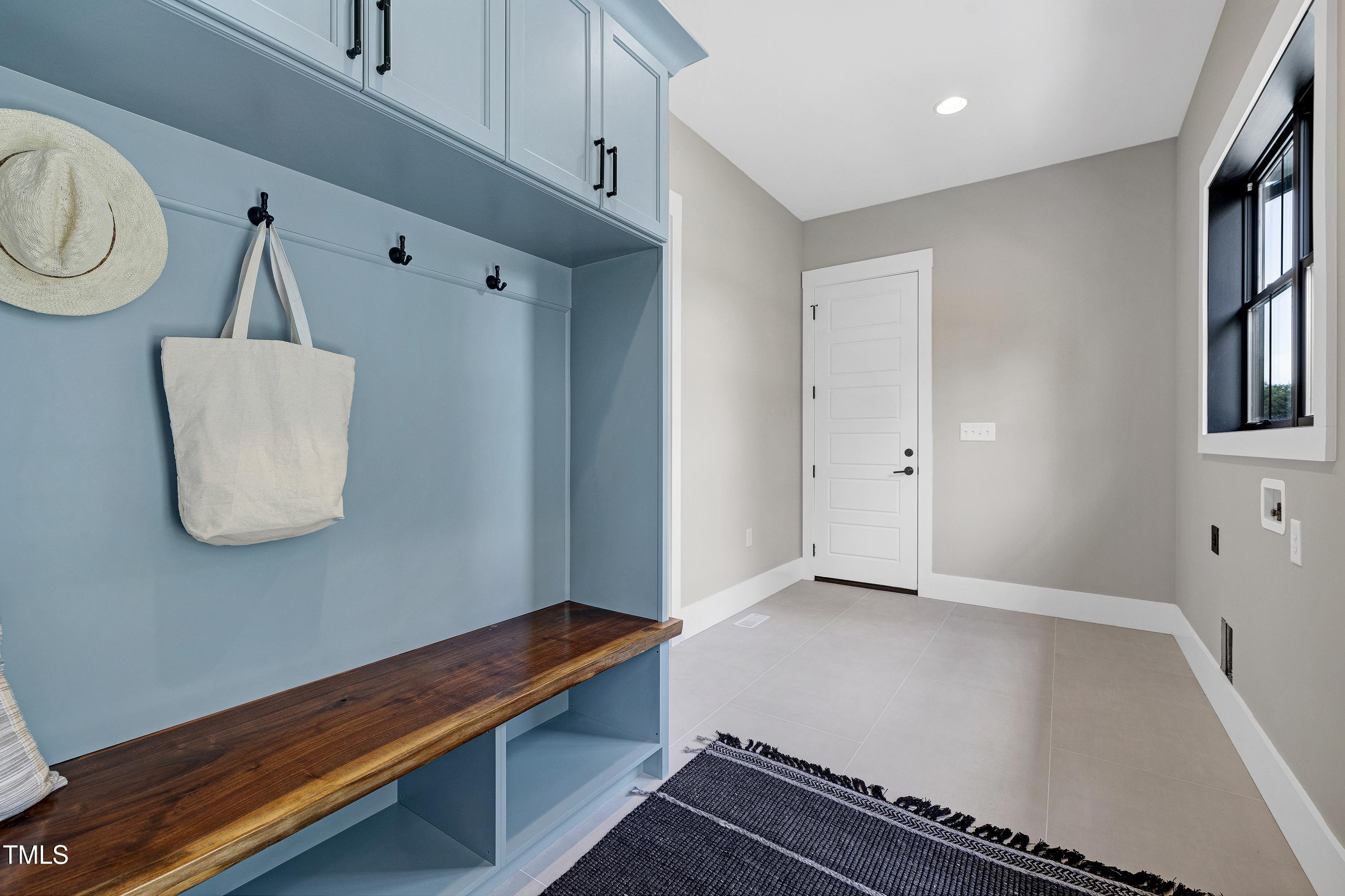 6509 Zebulon Road Wake Forest, NC 27587 - Photo 35 of 100 a room with wooden floor and cabinets