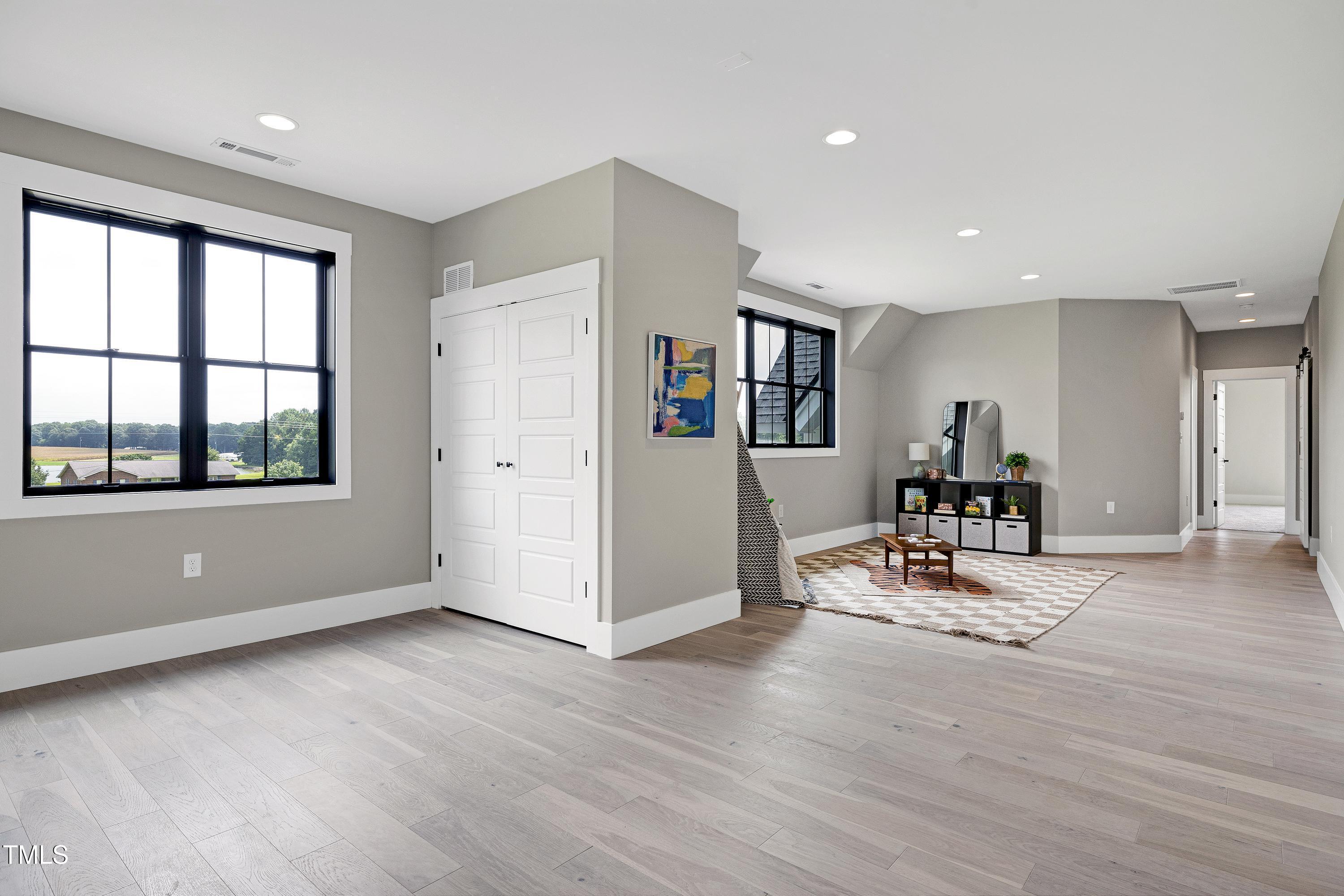 6509 Zebulon Road Wake Forest, NC 27587 - Photo 42 of 100 a living room with furniture and large window