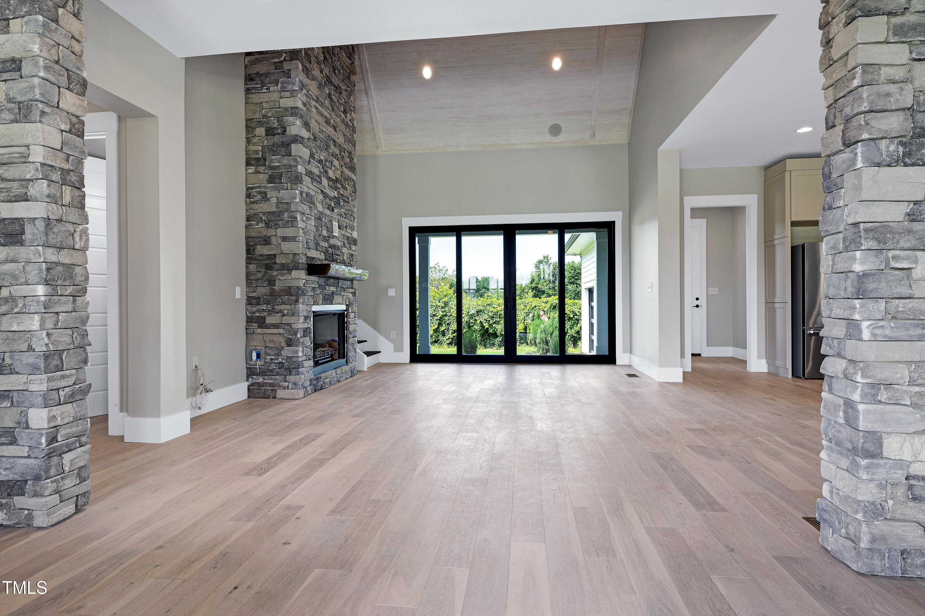 6509 Zebulon Road Wake Forest, NC 27587 - Photo 43 of 100 a view of an empty room with a window and wooden floor