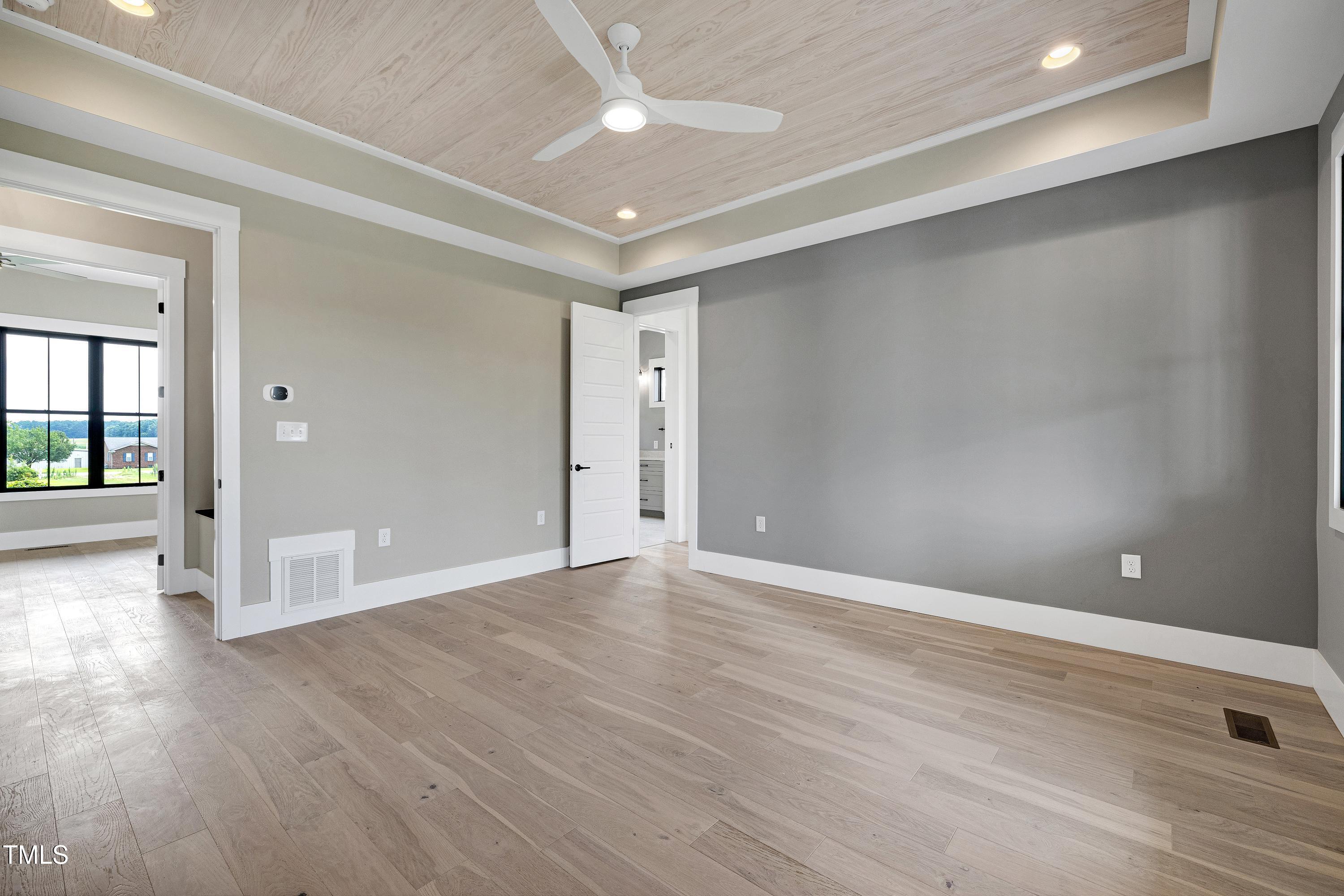 6509 Zebulon Road Wake Forest, NC 27587 - Photo 62 of 100 wooden floor in an empty room with a window