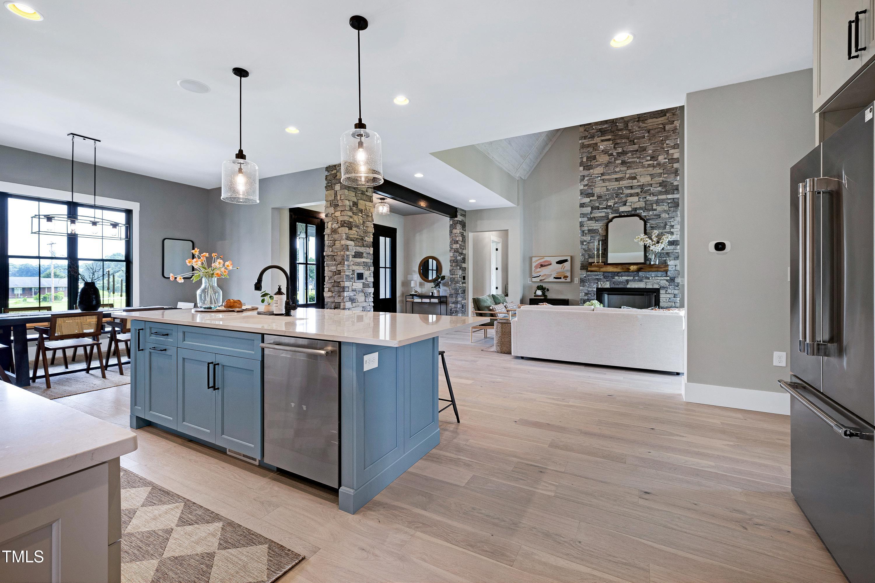 6509 Zebulon Road Wake Forest, NC 27587 - Photo 7 of 100 a large white kitchen with cabinets a sink and appliances