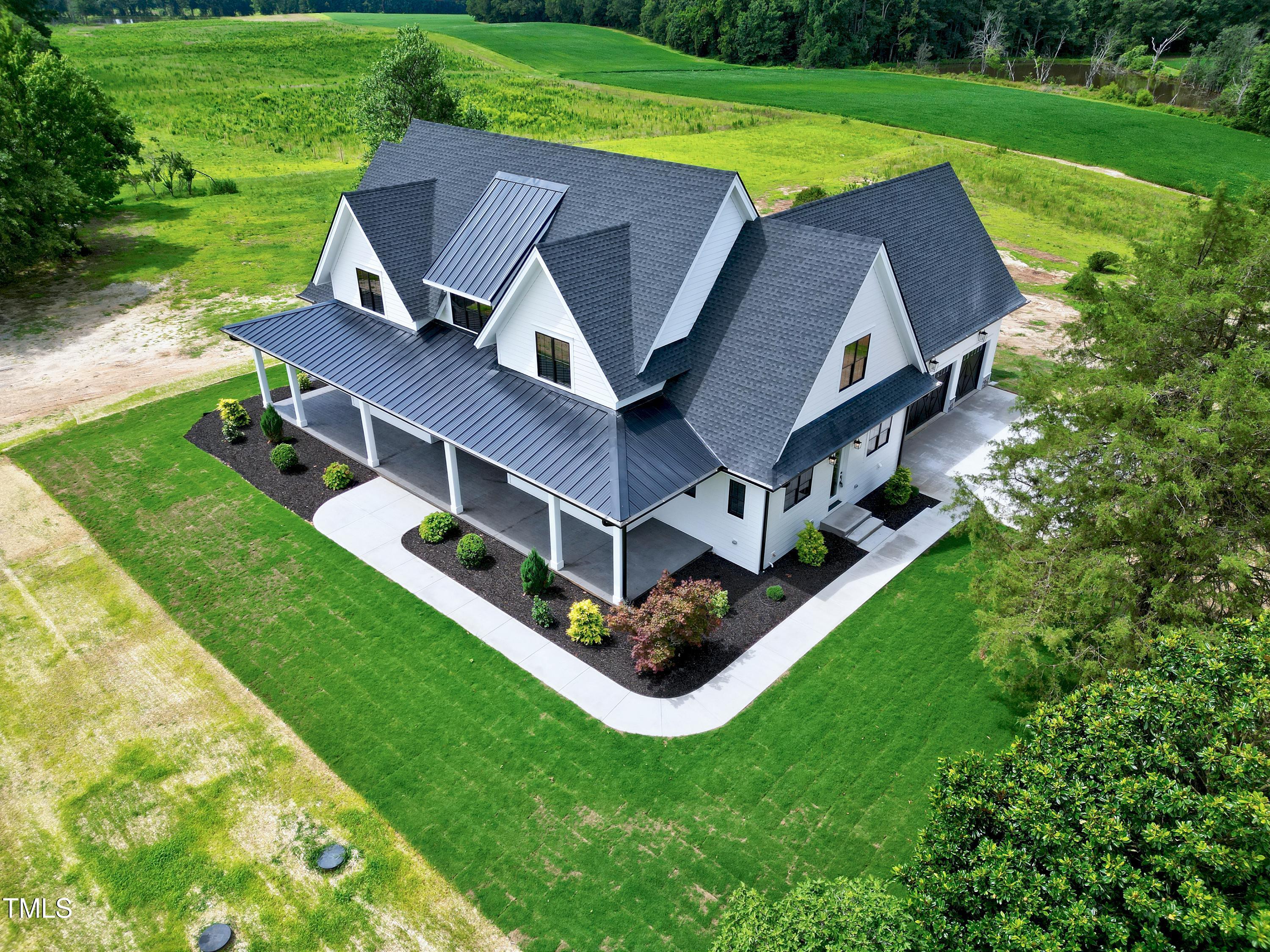 6509 Zebulon Road Wake Forest, NC 27587 - Photo 83 of 100 a aerial view of a house with a big yard