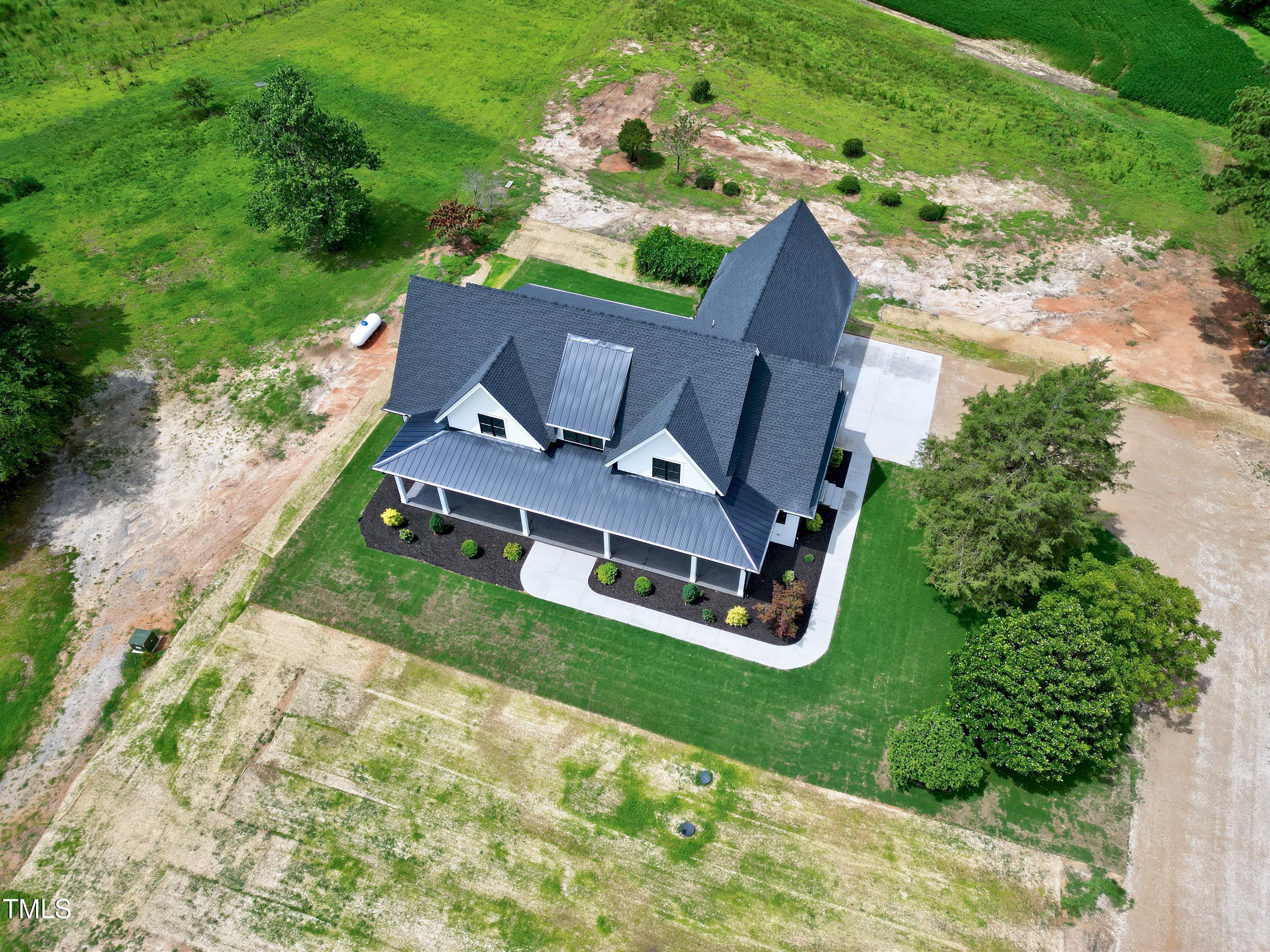 6509 Zebulon Road Wake Forest, NC 27587 - Photo 87 of 100 an aerial view of a house with garden space and street view