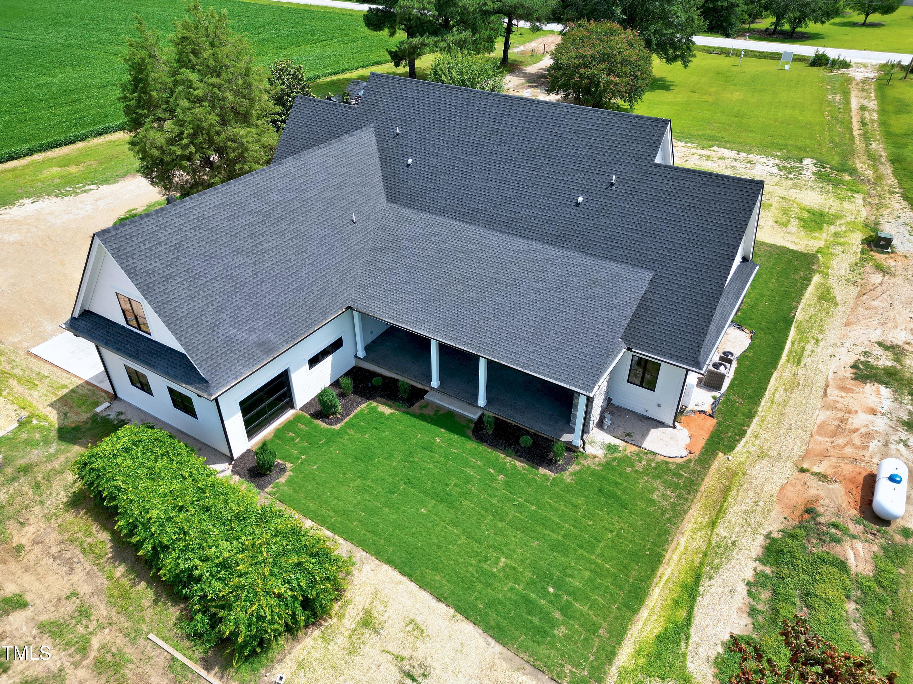 6509 Zebulon Road Wake Forest, NC 27587 - Photo 96 of 100 an aerial view of a house with a yard table and chairs