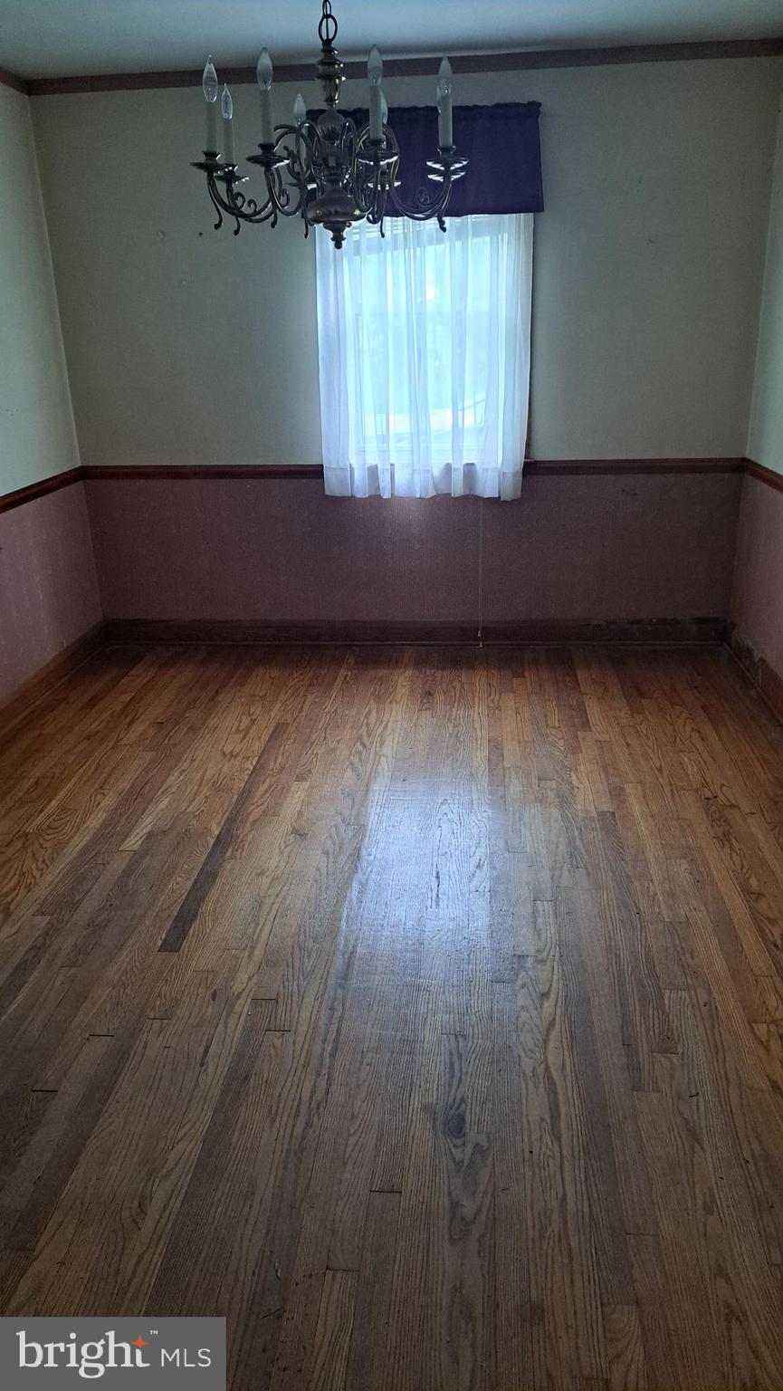 4401 East Joppa Road Perry Hall, MD 21236 - Photo 5 of 32 a view of room with window and wooden floor