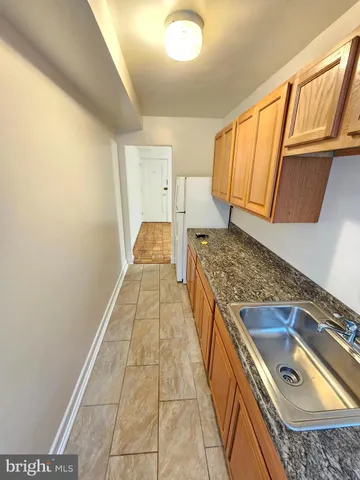 a view of a kitchen with a sink