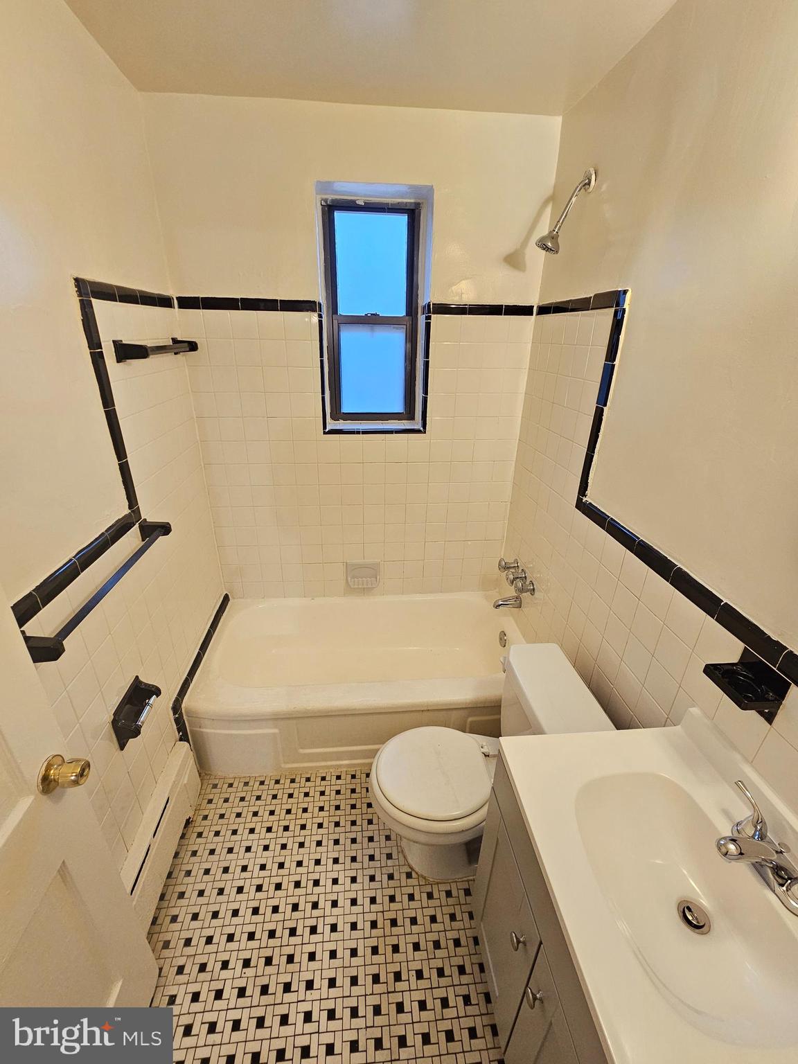 8711 Plymouth Street, Unit 1 Silver Spring, MD 20901 - Photo 8 of 14 a bathroom with a sink toilet and shower