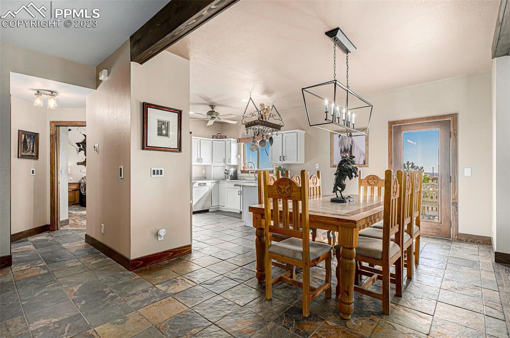 14965 Tanner Trail Elbert, CO 80106 - Photo 15 of 50 a view of a dining room and livingroom with furniture