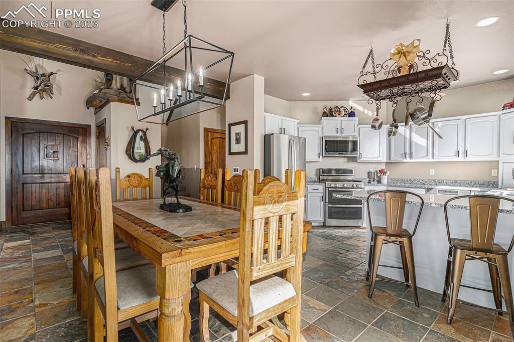 14965 Tanner Trail Elbert, CO 80106 - Photo 16 of 50 a view of a dining room with furniture