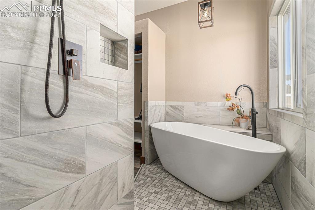 14965 Tanner Trail Elbert, CO 80106 - Photo 24 of 50 a white bath tub sitting next to a shower