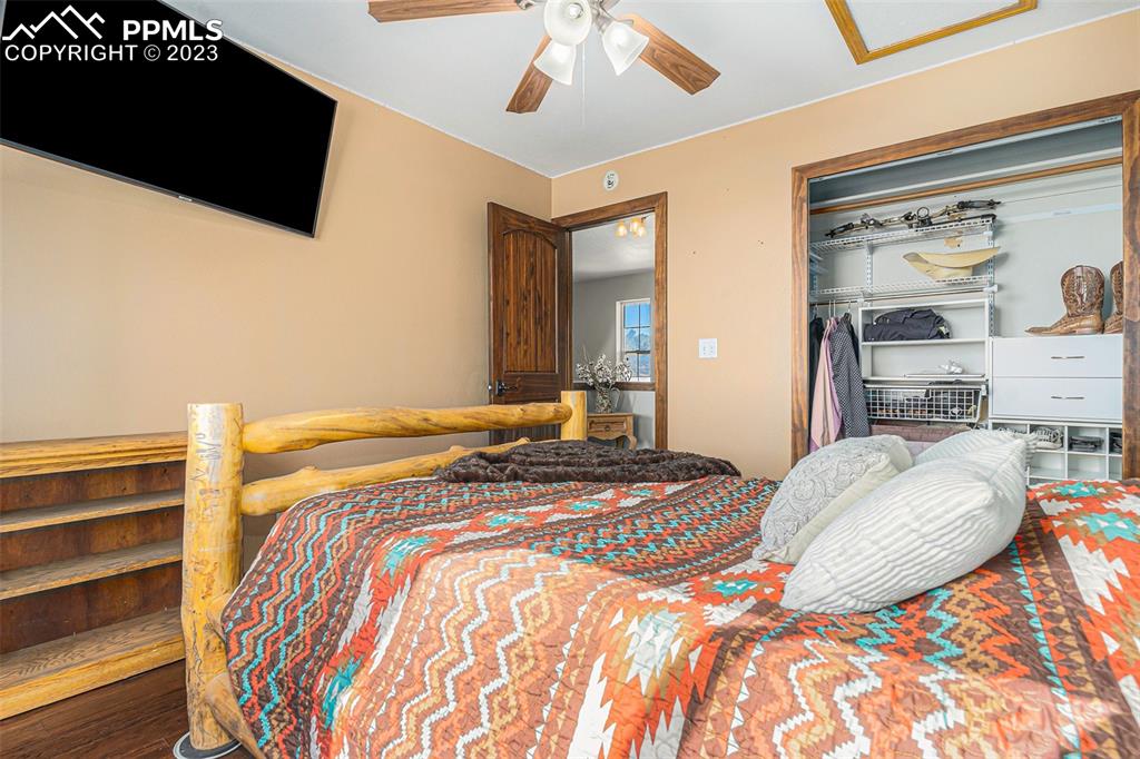 14965 Tanner Trail Elbert, CO 80106 - Photo 29 of 50 a bedroom with bed and flat screen tv