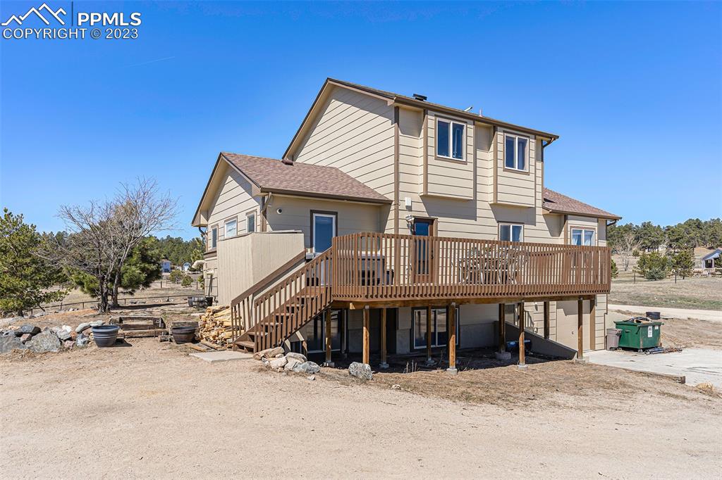 14965 Tanner Trail Elbert, CO 80106 - Photo 39 of 50 a view of a house with a patio