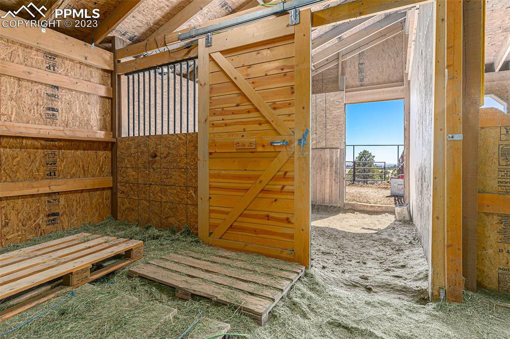 14965 Tanner Trail Elbert, CO 80106 - Photo 44 of 50 a view of wooden door with a bench