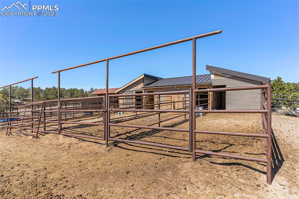 14965 Tanner Trail Elbert, CO 80106 - Photo 45 of 50 a view of a house with a small yard and wooden fence