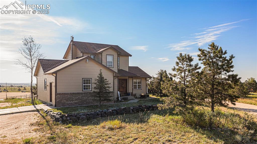 14965 Tanner Trail Elbert, CO 80106 - Photo 7 of 50 a view of a house with a yard