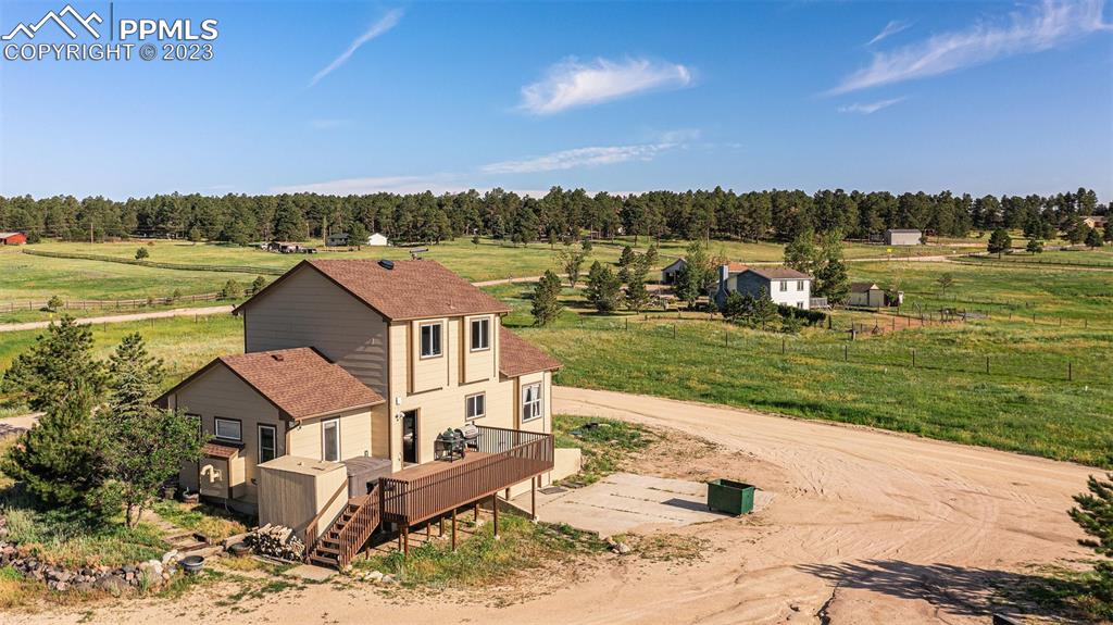 14965 Tanner Trail Elbert, CO 80106 - Photo 9 of 50 an aerial view of a house with a yard and lake view