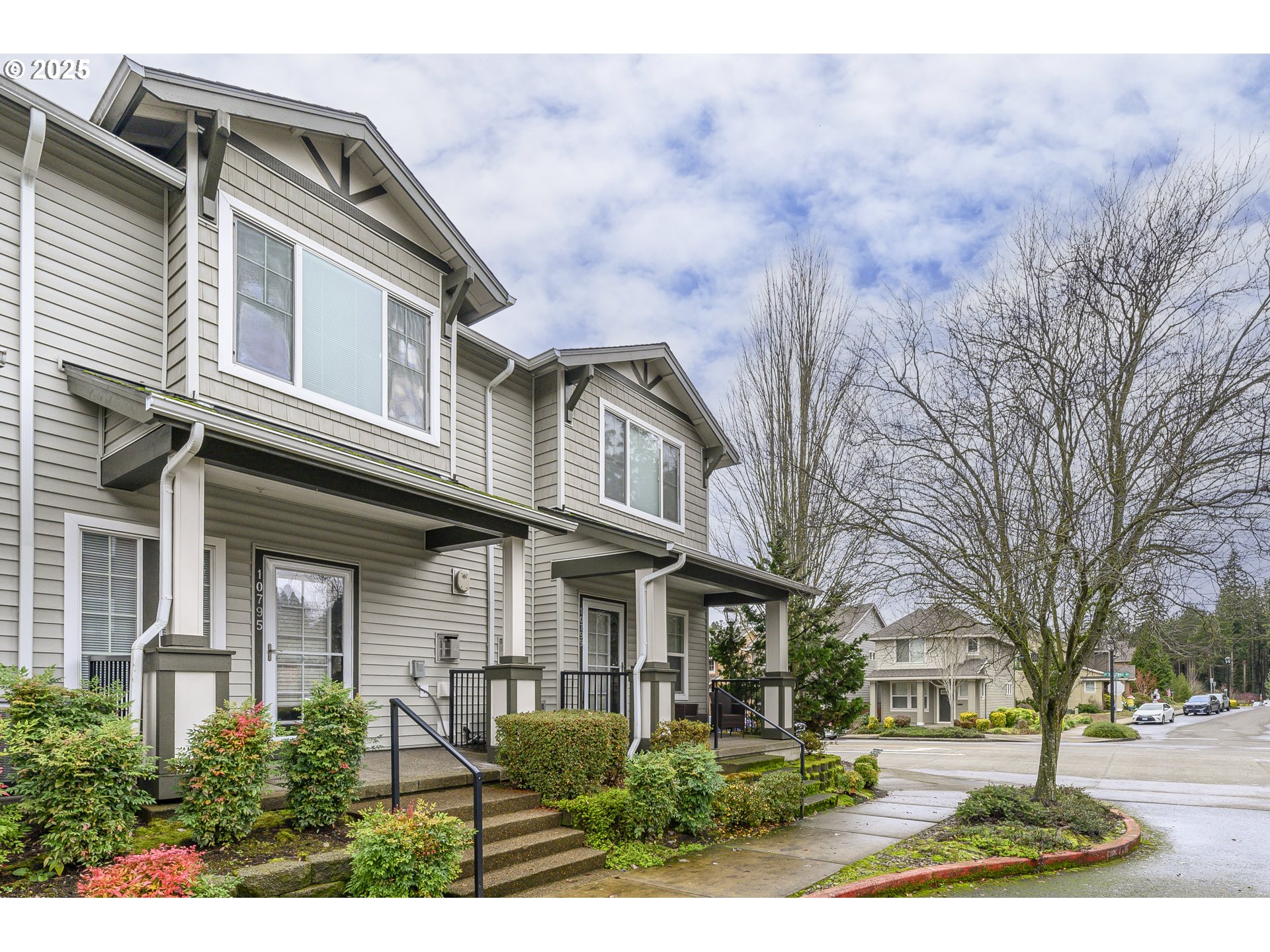 10795 Northeast Gateway Place Hillsboro, OR 97006 - Photo 1 of 27 a front view of a house with a yard