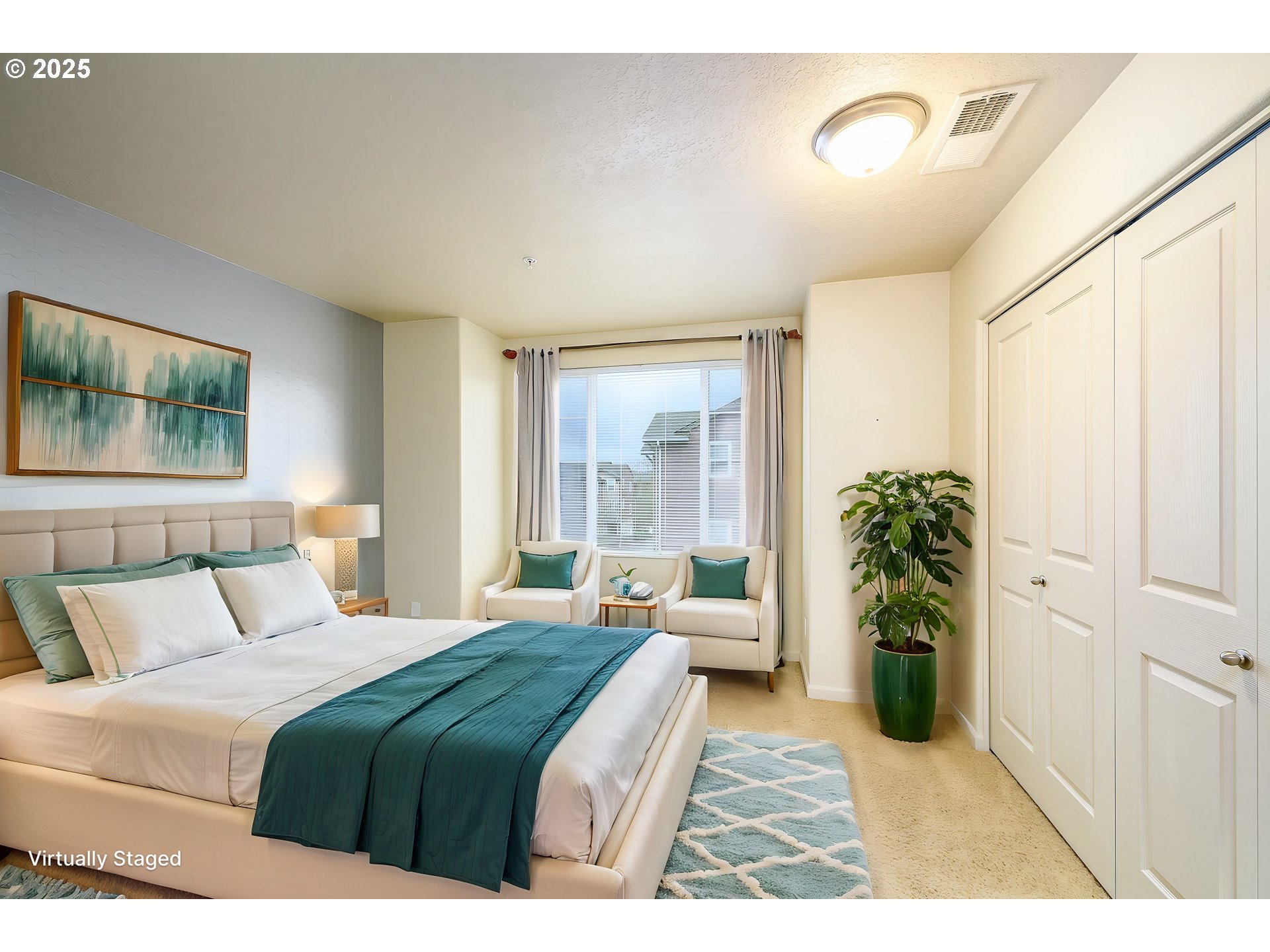 10795 Northeast Gateway Place Hillsboro, OR 97006 - Photo 14 of 27 a bedroom with a large bed windows and a potted plant
