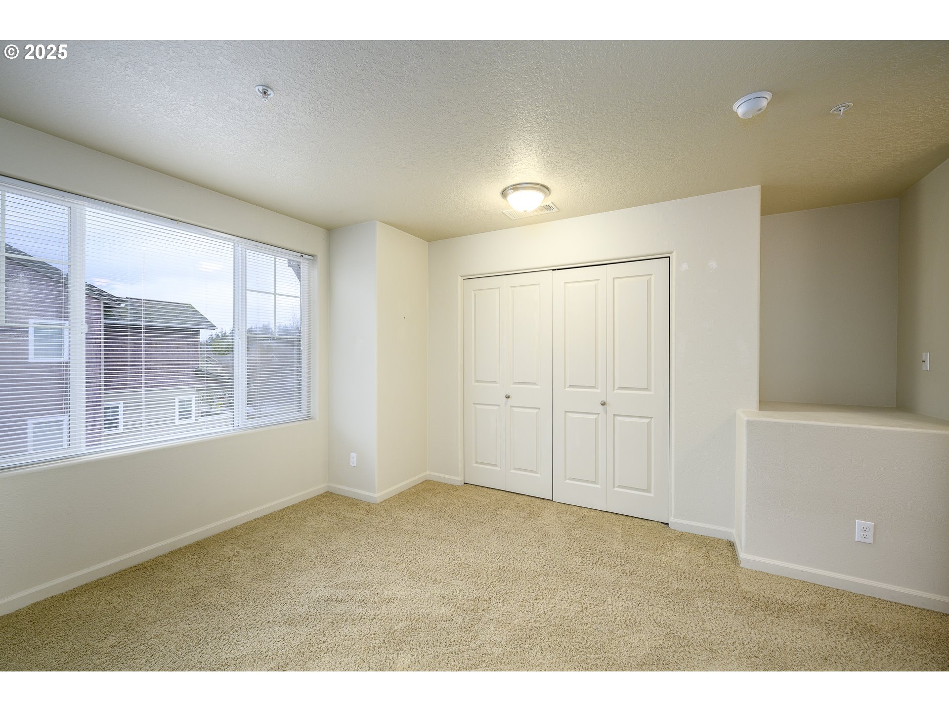 10795 Northeast Gateway Place Hillsboro, OR 97006 - Photo 16 of 27 a view of an empty room with a window