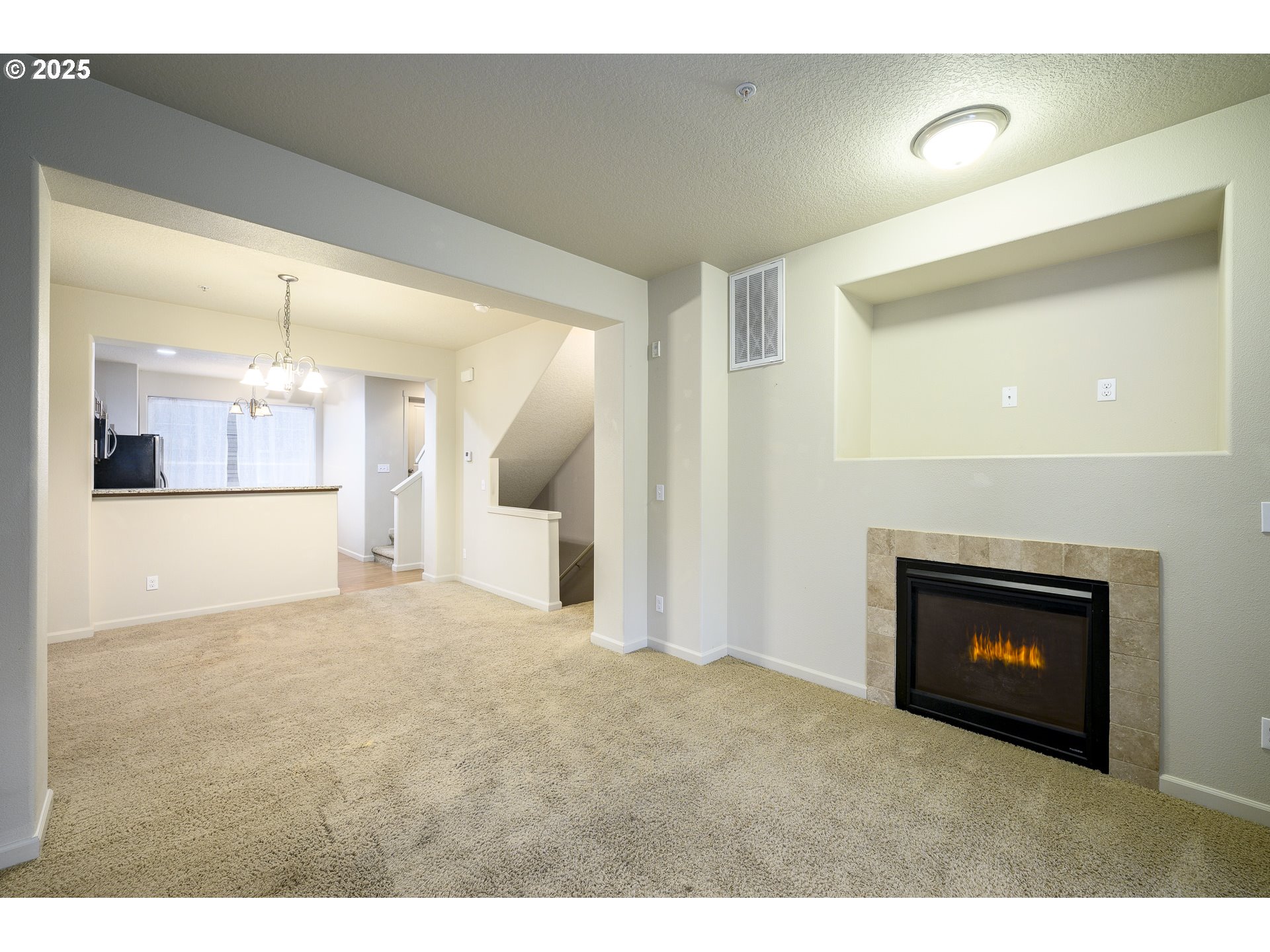 10795 Northeast Gateway Place Hillsboro, OR 97006 - Photo 6 of 27 a view of an empty room and a fireplace