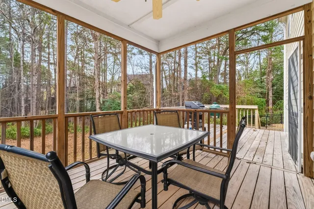 a view of a city from a balcony with furniture