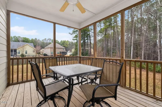 a view of a city from a balcony with furniture