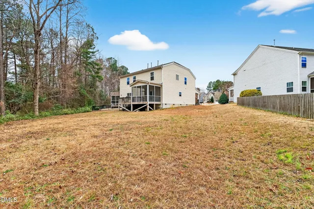 a view of a house with a snow in the yard