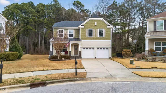 a front view of a house with yard