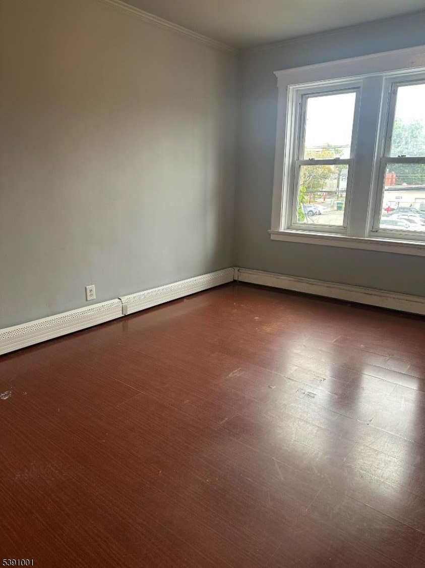 553 Bloomfield Avenue, Unit 2B Montclair, NJ 07042 - Photo 1 of 15 an empty room with wooden floor and windows