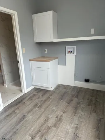 a view of an empty room with a sink