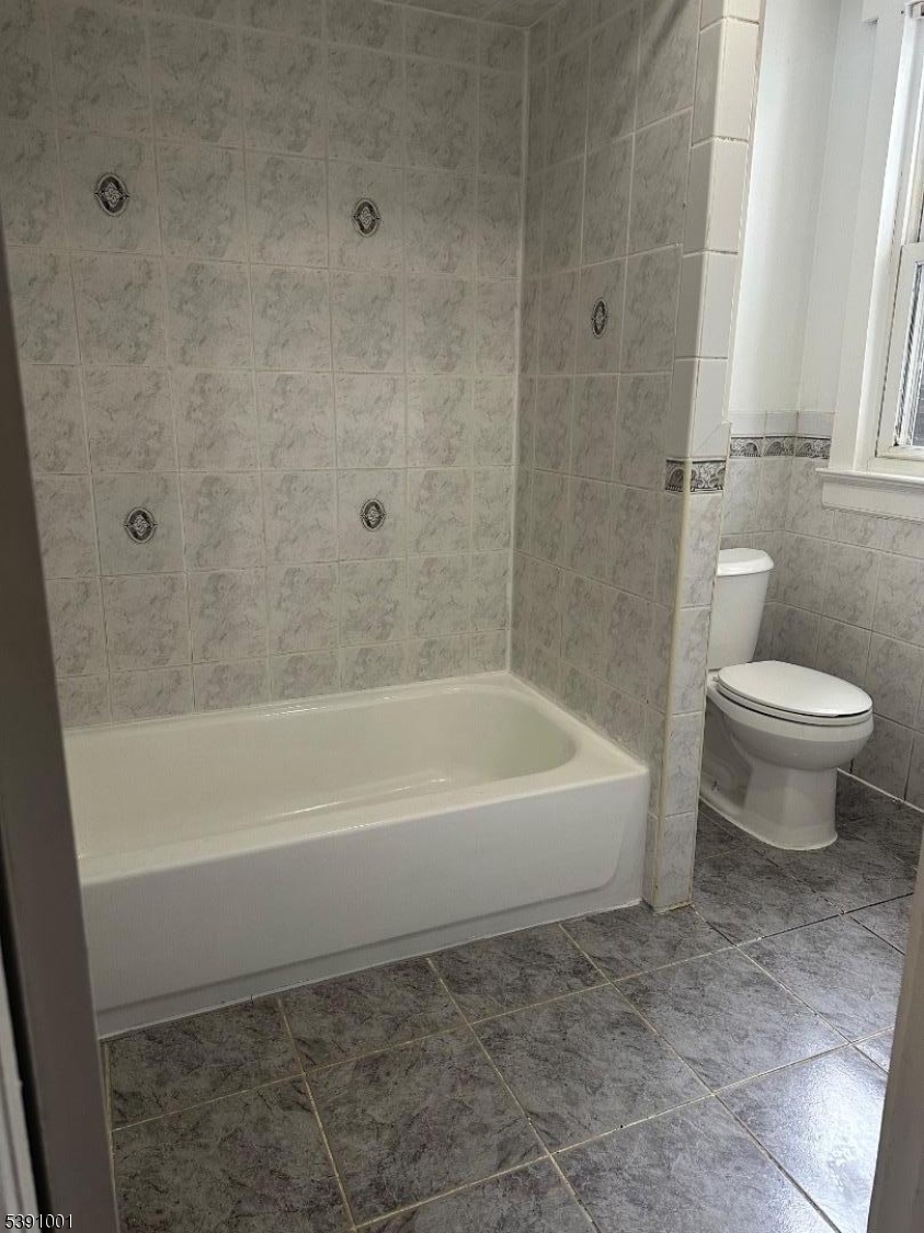 553 Bloomfield Avenue, Unit 2B Montclair, NJ 07042 - Photo 15 of 15 a bathroom with a toilet and a bath tub