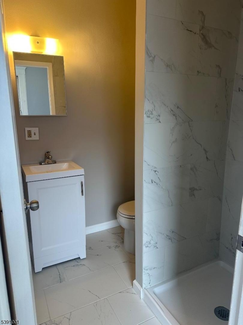 553 Bloomfield Avenue, Unit 2B Montclair, NJ 07042 - Photo 8 of 15 a bathroom with a sink a toilet and a shower