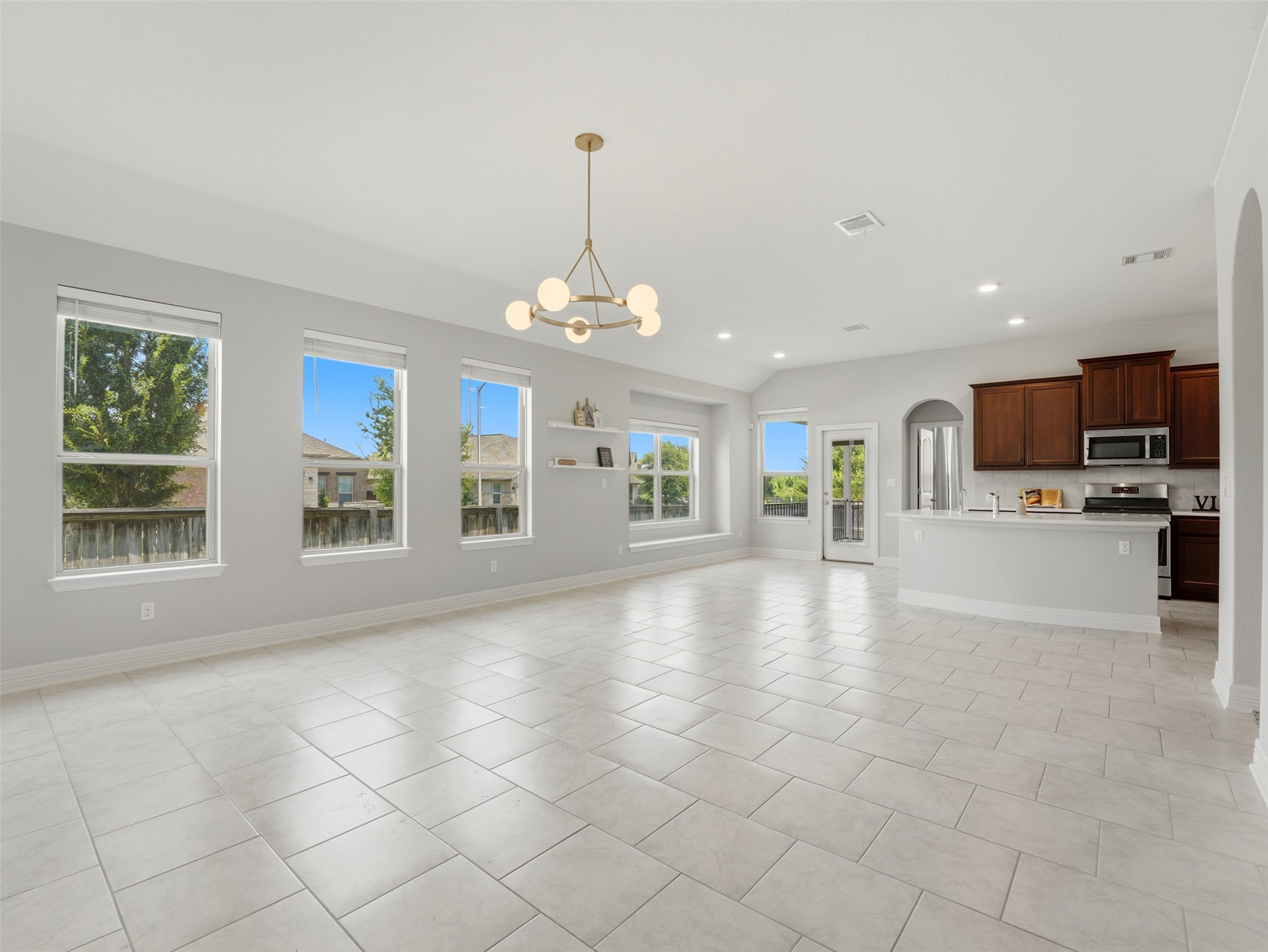 2132 Ringstaff Road Leander, TX 78641 - Photo 12 of 39 An open-concept great room and kitchen offer expansive living with natural light and easy flow.