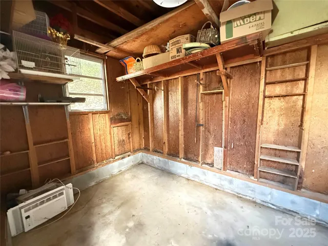 a view of a garage with wooden floor