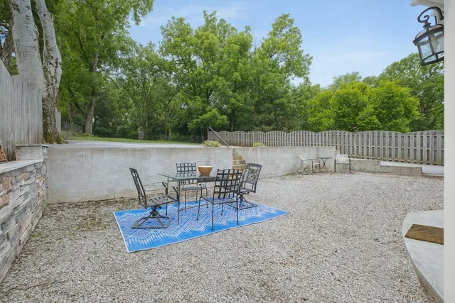 a view of a chairs and table in the patio