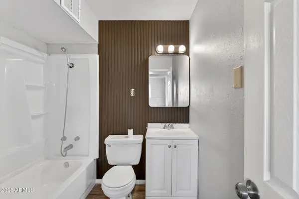 a view of a room with a ceiling fan