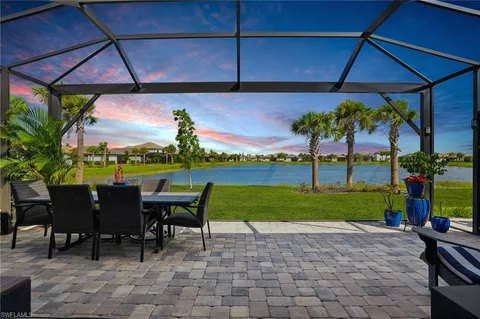 a view of a patio with a table chairs and a table