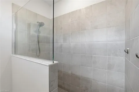 a bathroom with double sink and a mirror