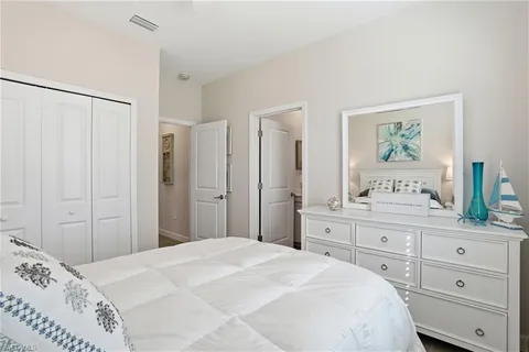 a bedroom with bed and a window