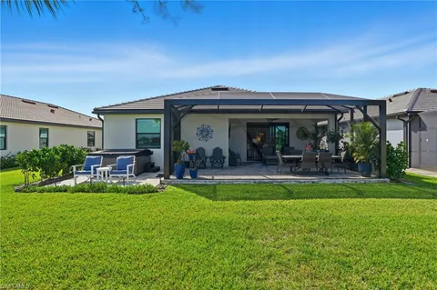 a view of a patio with a table chairs and a table
