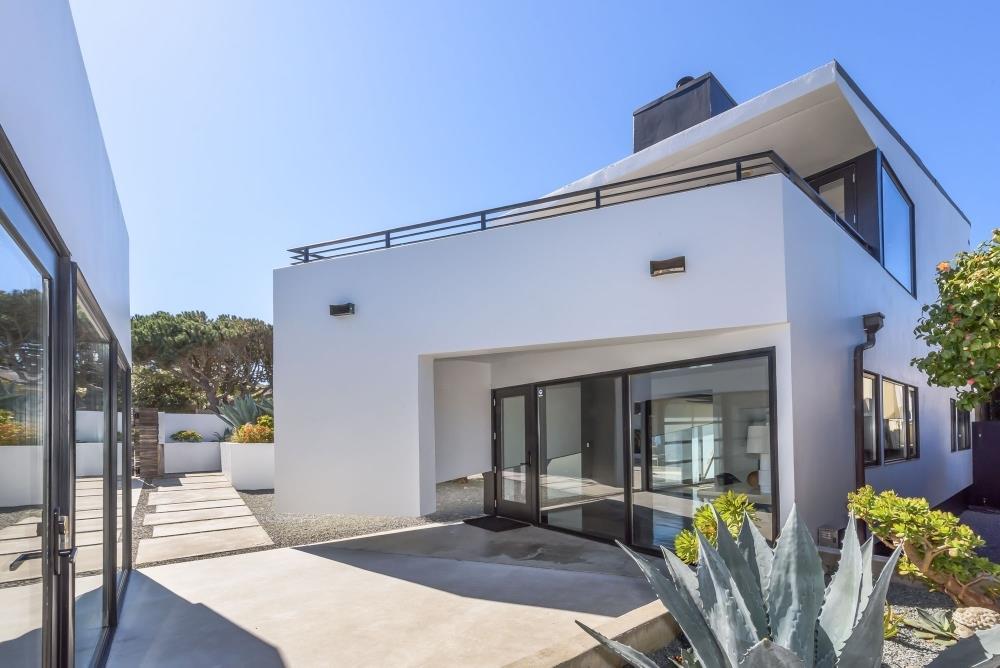 1241 Main Street Montara, CA 94037 - Photo 21 of 34 a view of a patio with table and chairs and potted plants
