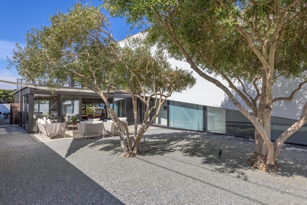 1241 Main Street Montara, CA 94037 - Photo 27 of 34 a view of a patio with table and chairs under an umbrella