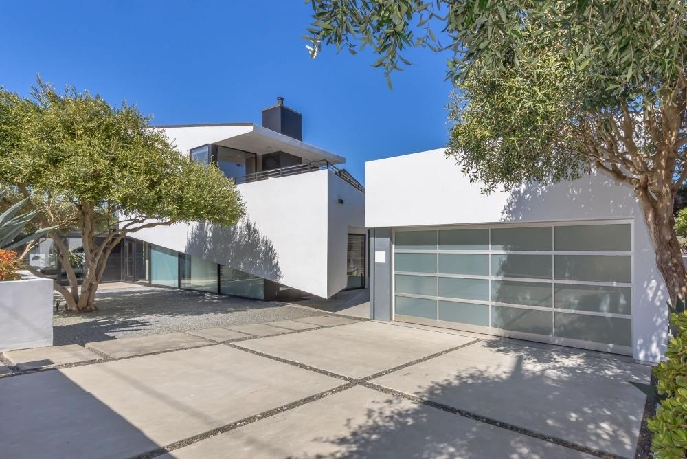 1241 Main Street Montara, CA 94037 - Photo 30 of 34 a front view of a house with a yard and garage