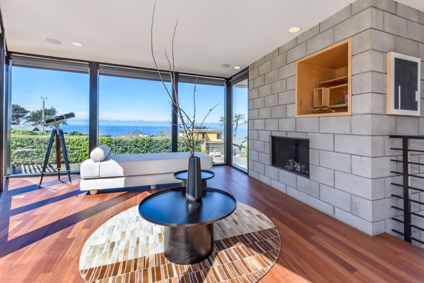 1241 Main Street Montara, CA 94037 - Photo 10 of 34 a living room with furniture a fireplace and a table