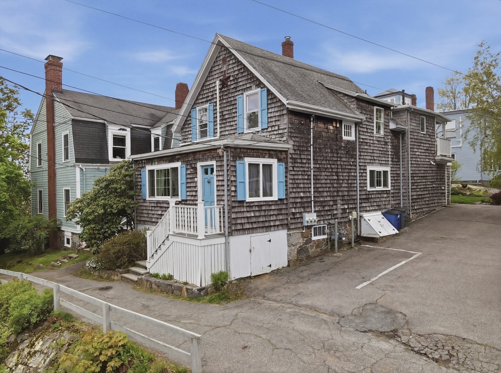 16 Evans Road, Unit 2 Marblehead, MA 01945 - Photo 18 of 24 a front view of a house with a yard